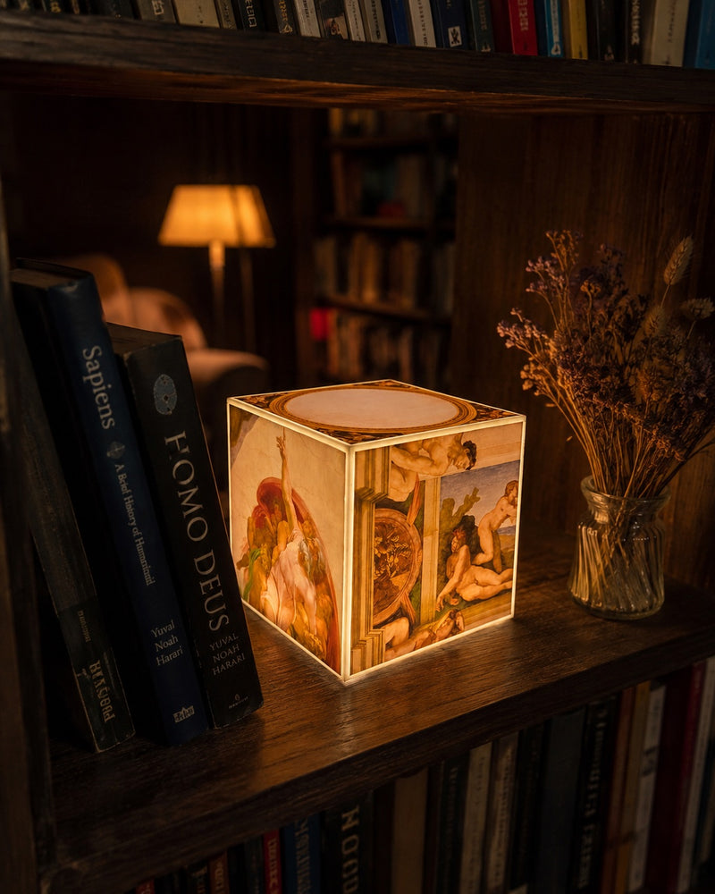 Cube Lamp - The Creation of Adam - lifestyle photo on a bookshelf