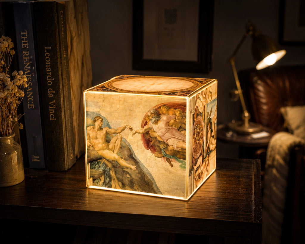Cube Lamp - The Creation of Adam - lifestyle photo beside Renaissance art books